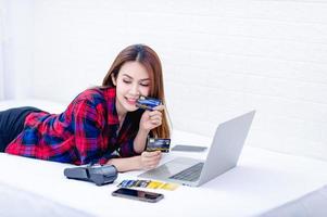 The woman and the computer in the white room Happy work The concept of happy working at home photo