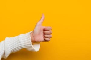 like showing thumbs up say you are the best Show approval signal, suggest something, copy space for your ad content. photo
