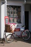Penarth, Wales, UK, 2014. View of an old tradesman bicycle outside a sweet shop in Penarth photo