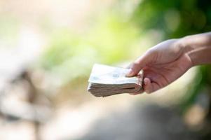 Close-up photos and bank cards used for business and currency exchange purchases. Hand and money concept