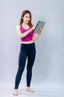 Women play iPad and smile happily with online communication. The concept of 5G online communication photo