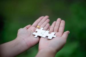 Hands and puzzles, important pieces of teamwork Teamwork concept photo