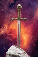 Excalibur, the mythical sword in the stone of King Arthur photo