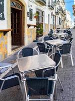 CASARES, ANDALUCIA, SPAIN, 2014. Cafe culture street scene in Casares Spain on May 5, 2014 photo