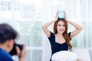 Woman and blue alarm clock in the bedroom Relaxation concept photo