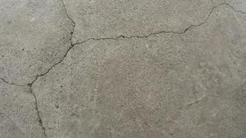 viejo hormigón agrietado. Muro de cemento de hormigón grunge con crack, para su diseño y textura de fondo. pasarela de piedra. textura de cemento