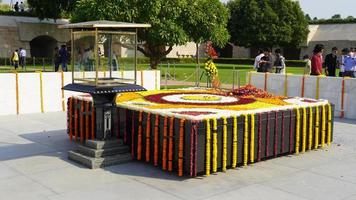Raj Ghat is a memorial to Mahatma Gandhi. It is a black marble platform that marks the spot of Mahatma Gandhi's cremation. photo