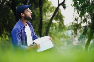 a student is writing with book image photo