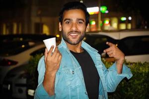 Asian man having a tea cup enjoying evening tea photo