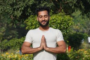 a man doing prayer and have positive energy photo