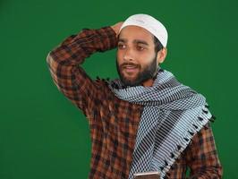confused muslim man image on Green screen background. photo
