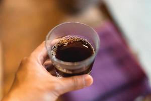 Close up of hand brewing coffee photo