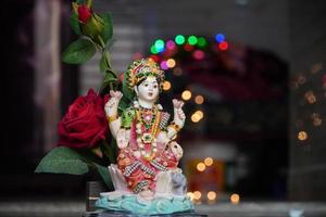 laxmi devi wallpaper with red rose image HD photo