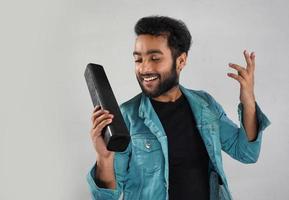 Image of a man with sound bar he's listening music and happy photo