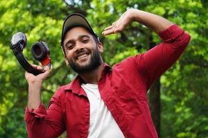 a man with headphone and smiling photo