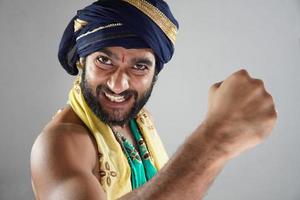 winner king images - indian man in Theater acting as a king photo