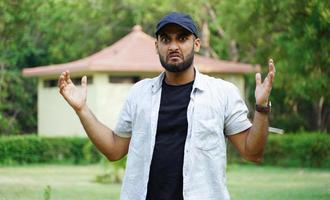 a unhappy man image near his house photo