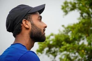 a young man watching nature and thinking photo