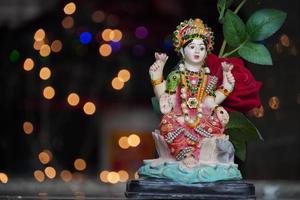 laxmi devi wallpaper with red rose image HD photo