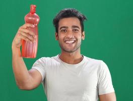 a boy with water bottle and happy face photo