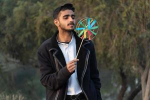 Young boy with Indian handmade toy photo