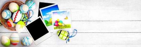 Easter background with colorful easter eggs on wooden background. photo