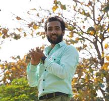 Man With Cricket Ball while Playing Cricket at ground photo