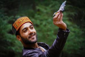 With aero plane Portrait himachali boy on the street in Himalayan photo