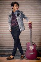 indian young man with beautiful guitar photo