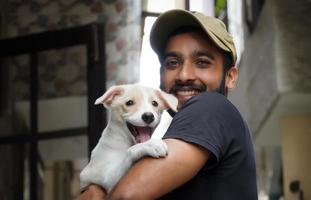 a dog lover young boy with his dog happy and smiling photo