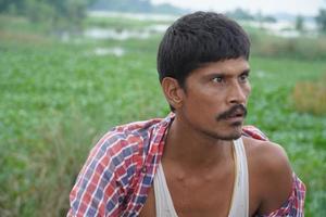 poor farmer in village photo