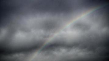 Rainbow in Dark Sky HDR photo