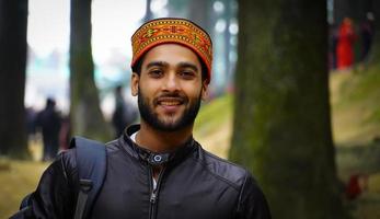 himachali young man image watching camera photo