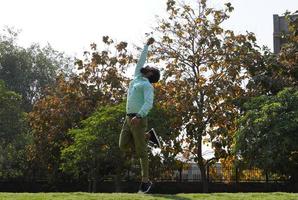 Indian Man in action of catching ball in cricket match Ground image photo