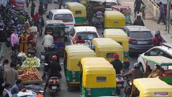 Large amounts of traffic on a road in India photo