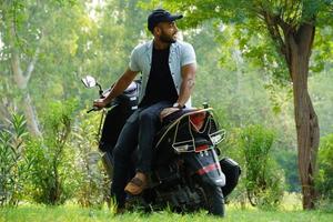 a man with his new scooter full size image photo