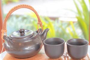 hand pour Chinese or Japanese traditional tea from clay pot
