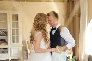 Groom puts a wedding ring on his bride. photo