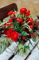 Winter wedding bouquet of red roses photo