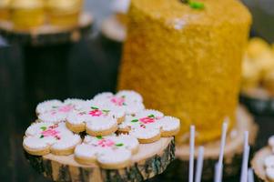 cakes on a wooden table for a wedding candy bar photo