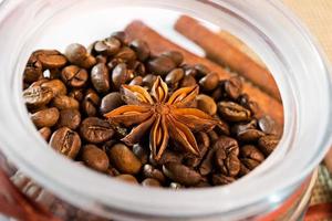 Open a bank with coffee beans lying on sackcloth and napkins photo