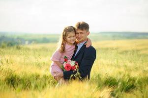 Happy family in the field photo