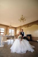 Groom puts a wedding ring on his bride. photo