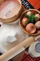 Chicken eggs with slices of bread on the table with milk photo