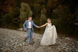 Wedding photo session of the bride and groom in the mountains. Photoshoot at sunset.