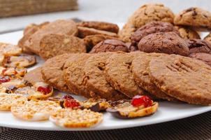 many different types of cookies lay on a plate photo