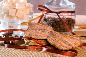 Open a bank with coffee beans lying on sackcloth and napkins photo