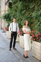 Beautiful stylish couple on a date on the streets in the old city. photo