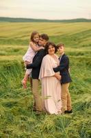 Happy family in the field photo