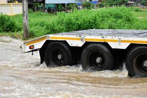 Pickup car and vehicle in floodwater, car insurance and dangerous situation concept. photo